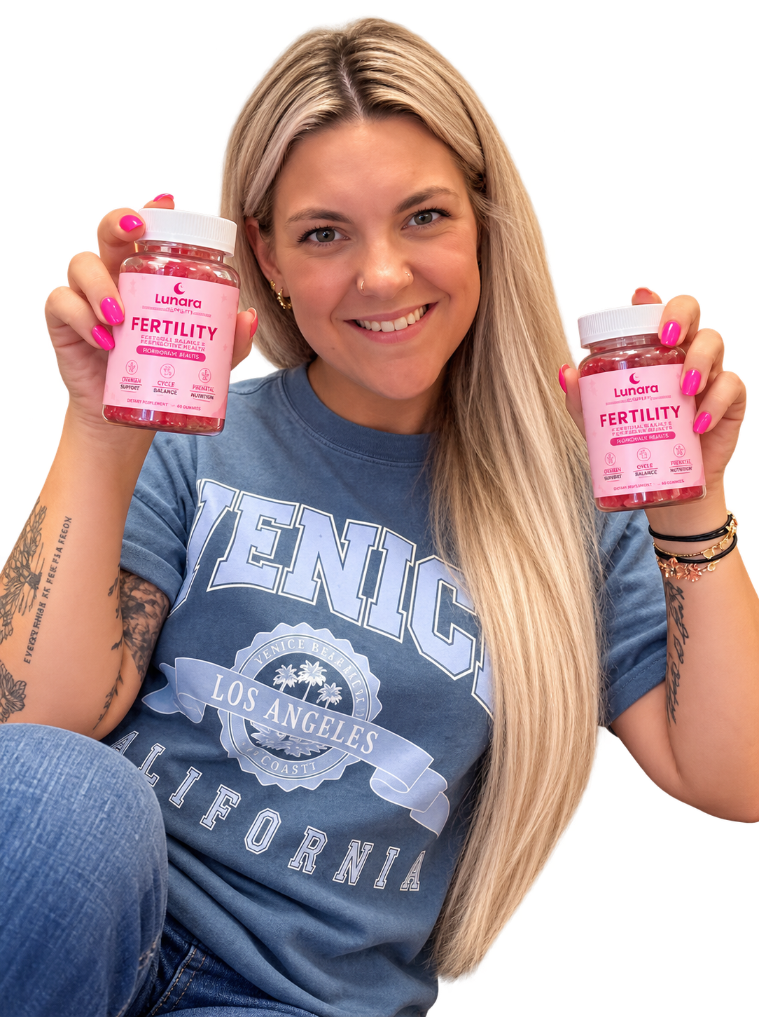 Hailey, founder of Lunara, holding two jars of Lunara Fertility Gummies